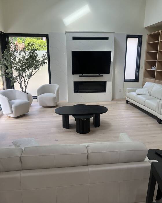 Stone fireplace surround fabricated by Beautiful Granite & Marble